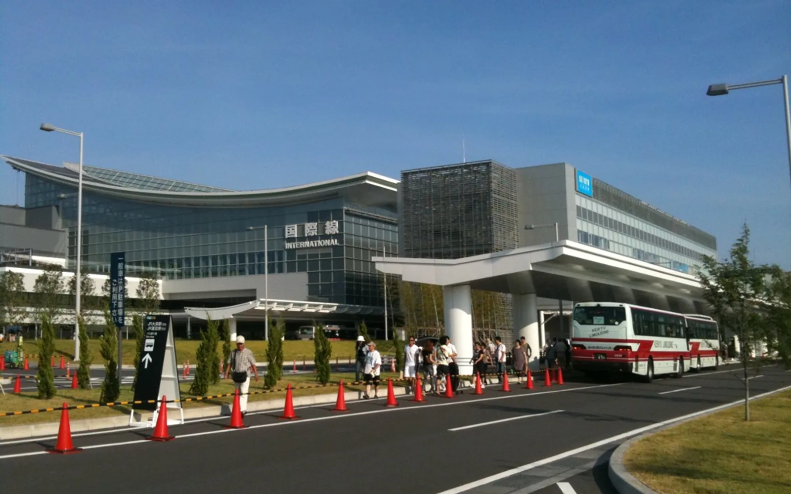 Haneda Airport international terminal exterior for airport pickup planning.